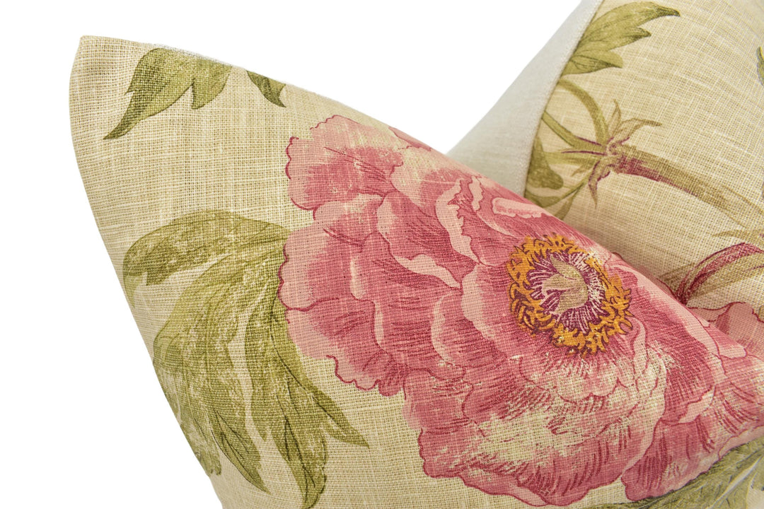a close up of a pillow with a flower on it