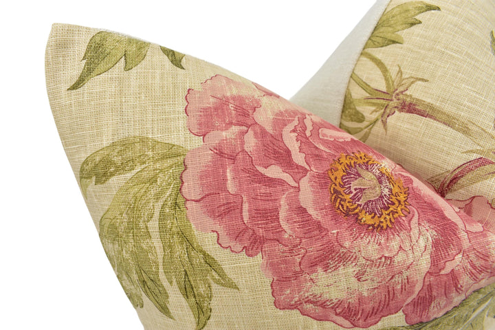 a close up of a pillow with a flower on it