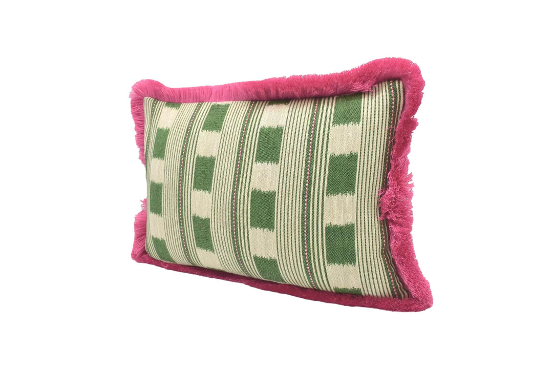 A decorative pillow with a green and white striped pattern and a pink fringe border, placed against a white background.