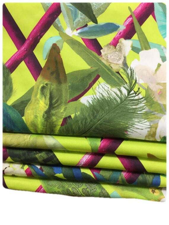 Elegant Designers Guild Roman Blind with Canopy in vibrant lime color for modern home interiors.