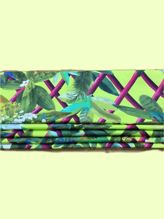 Elegant Designers Guild Roman Blind with Canopy in vibrant lime color for modern home interiors.