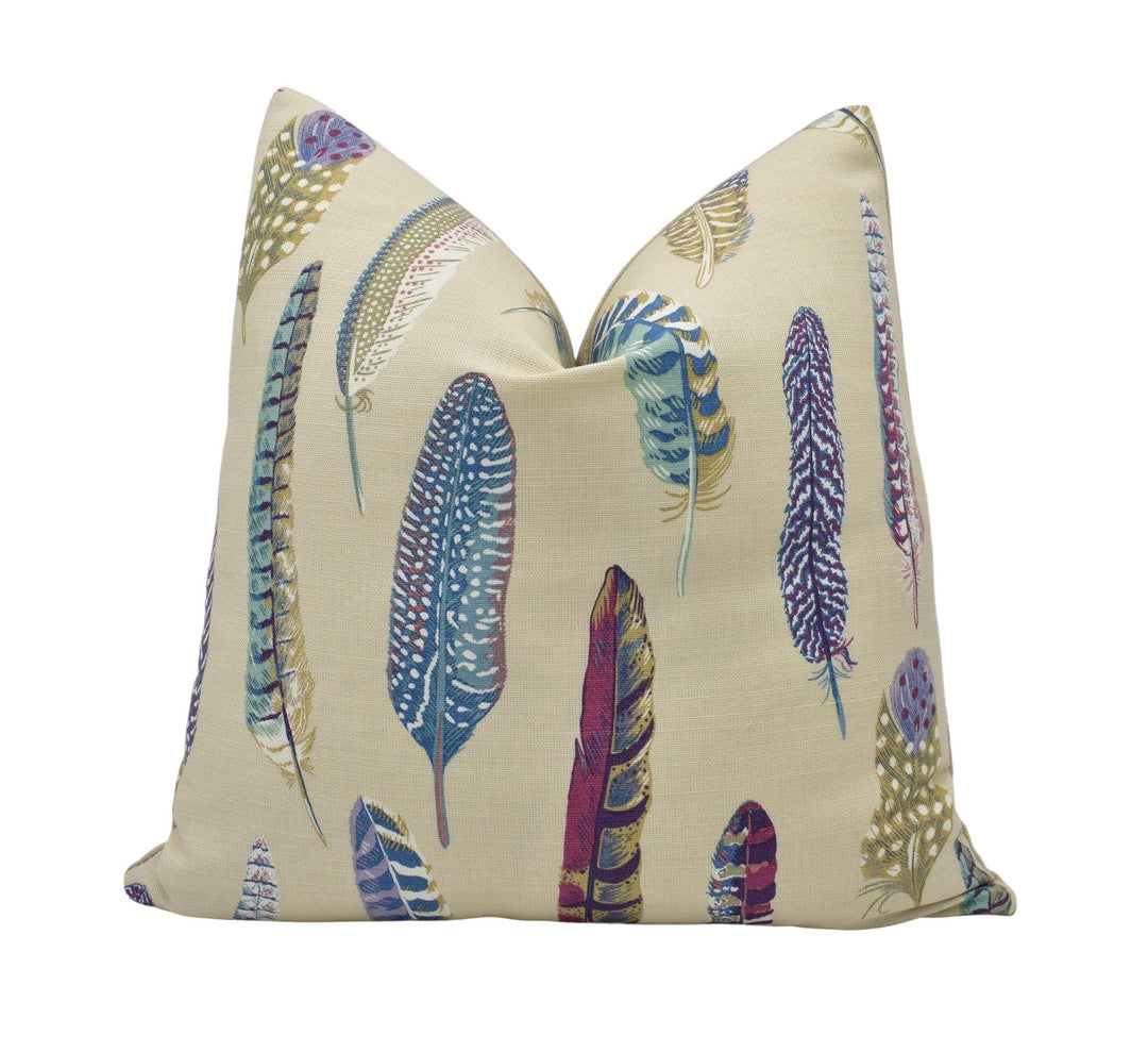 a pillow with a colorful feather pattern on it