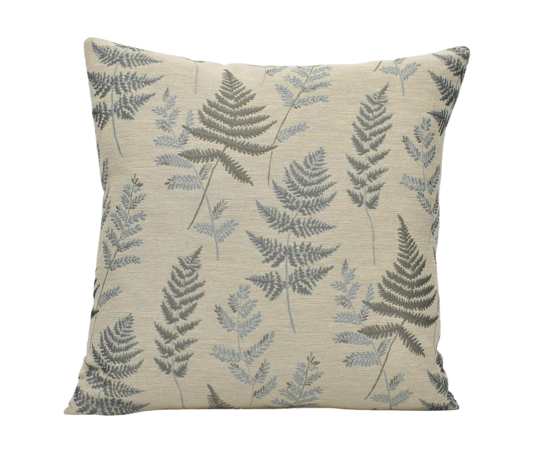 a pillow with a leaf pattern on it