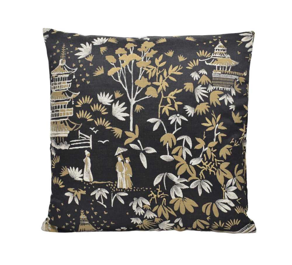 a black and gold pillow with a pattern on it