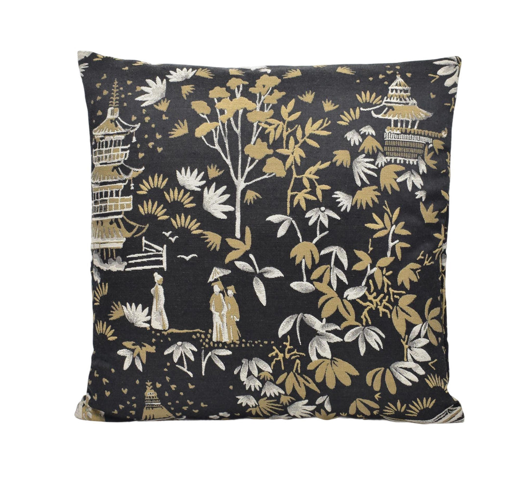 a black and gold pillow with a pattern on it