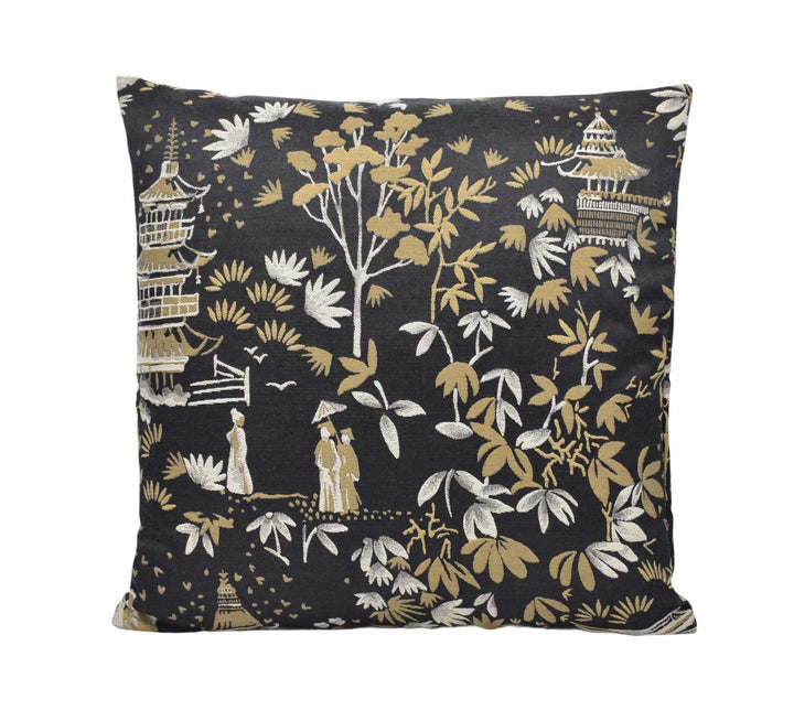 a black and gold pillow with a pattern on it