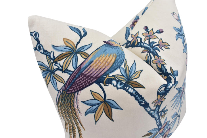 a decorative pillow with a bird on it