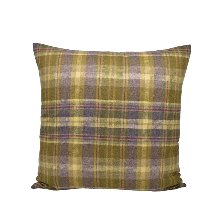 A square throw pillow with a plaid pattern in shades of green, purple, and yellow.