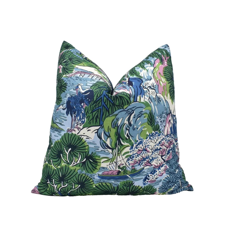 a vibrant, colorful pillow with a tropical, nature-inspired design.