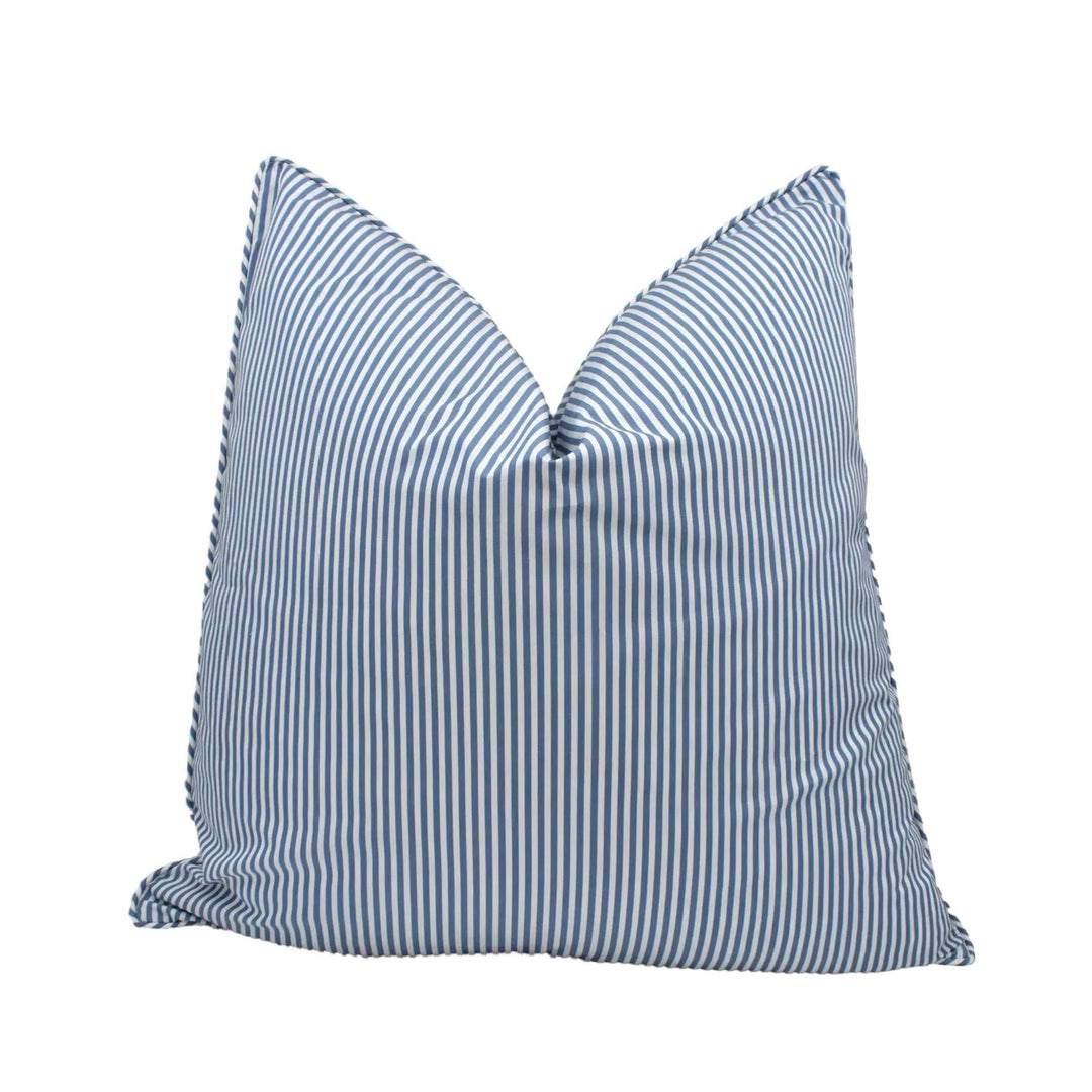 A blue and white striped pillow is shown against a white background.