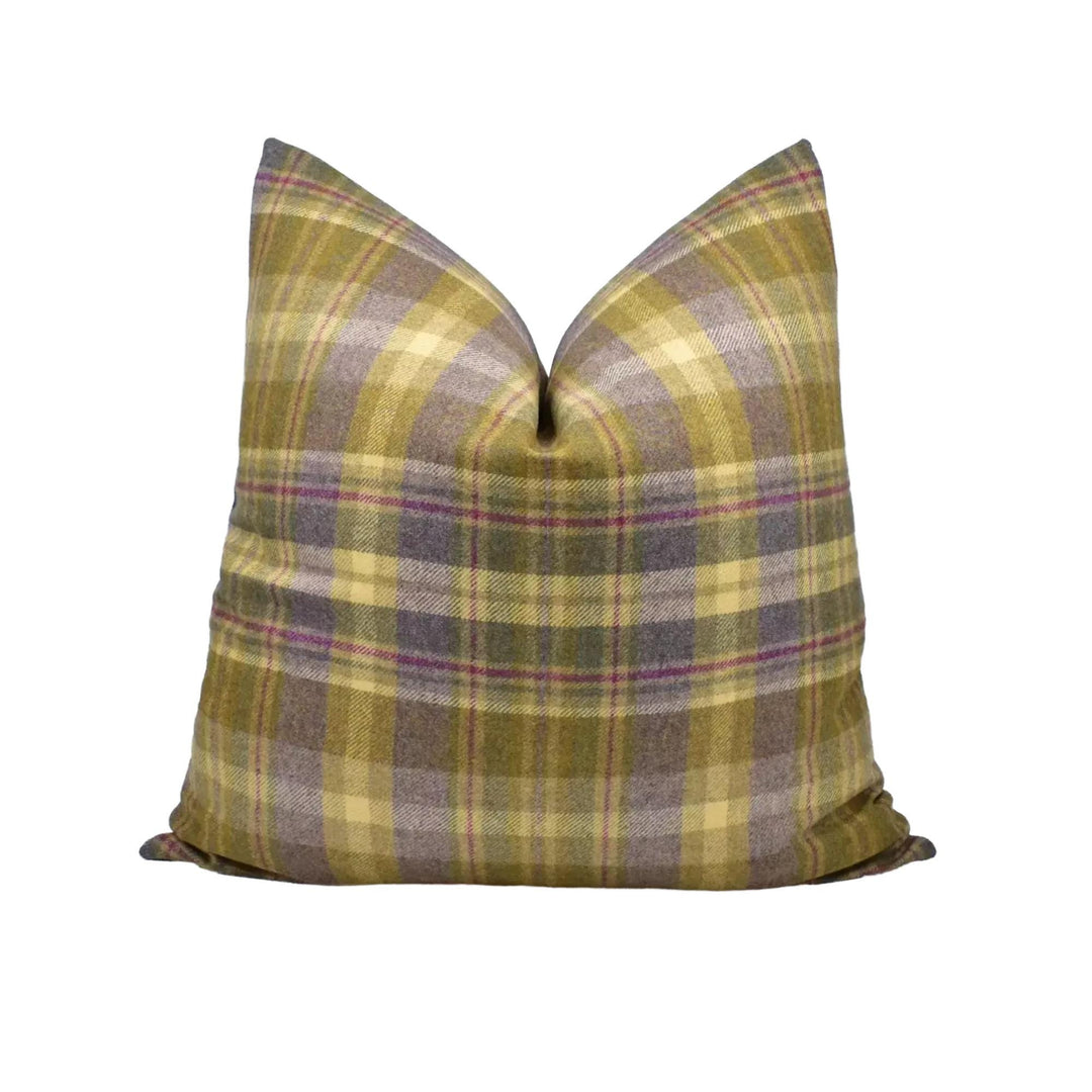 A plaid throw pillow with a vibrant, multicolored pattern.