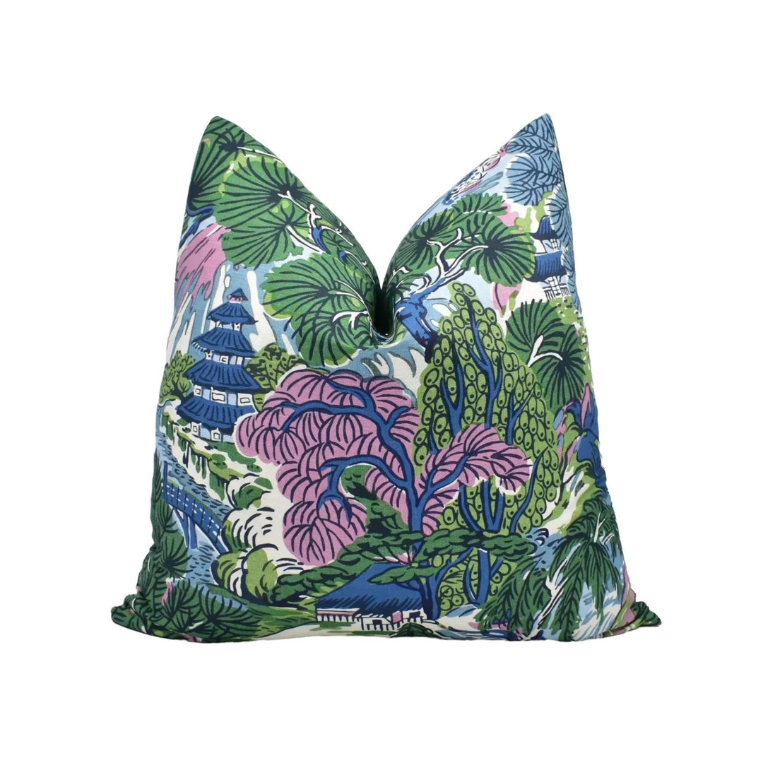 a vibrant, colorful pillow with a tropical garden design.